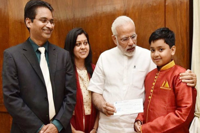 NRI boy donates prize money