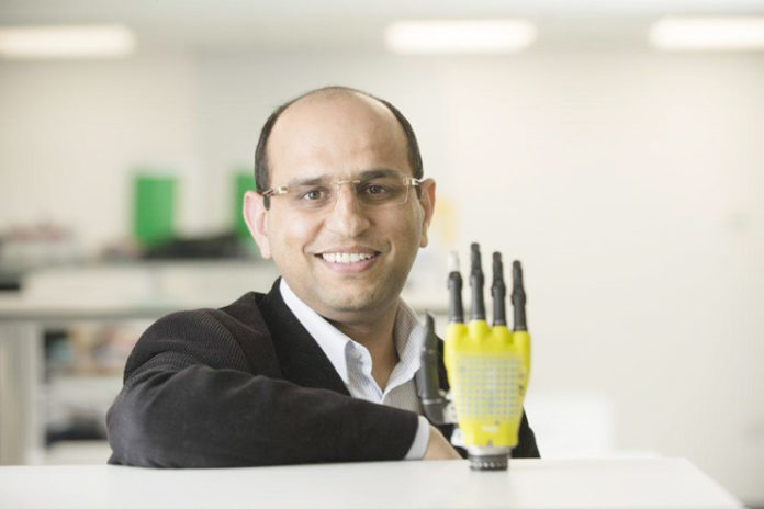 Scientist Creating Robotic Hand